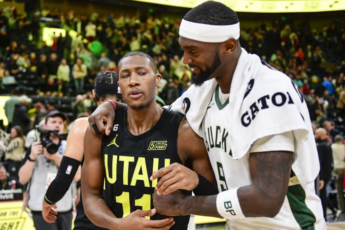 Utah Jazz guard Kris Dunn (11) congratulates Milwaukee Bucks forward Bobby Portis (9)